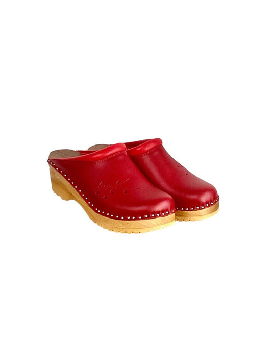 The Troentorps 'O'Keefe' Cutwork Clogs combine traditional craftsmanship with modern design, featuring intricate cutout details and a comfortable wooden base. With their versatile style and sturdy construction, these clogs offer both a chic aesthetic and lasting comfort for everyday wear.