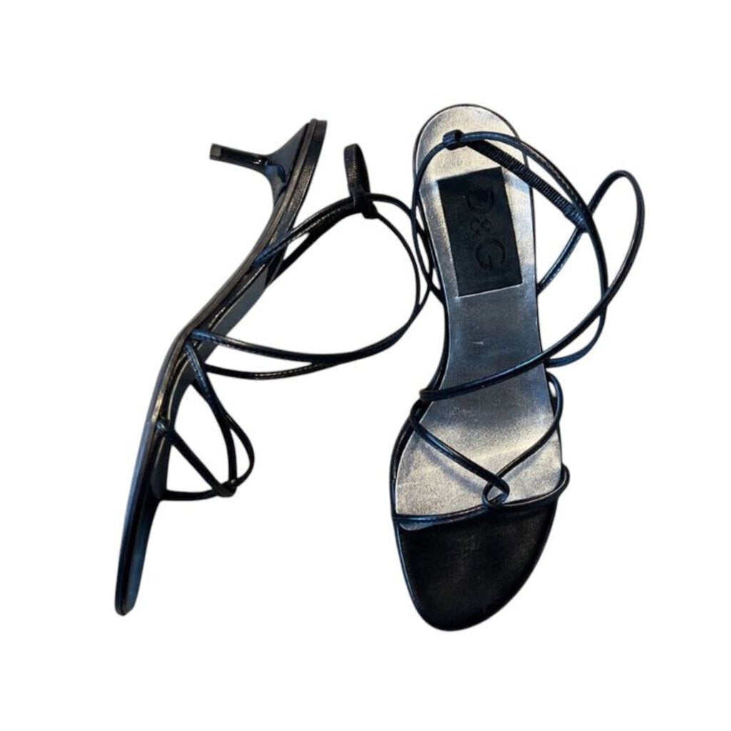 The D&G 'Scarpe' Kitten Heel Sandals are a refined and elegant footwear choice, featuring a delicate silhouette with a modest, yet stylish, kitten heel. Crafted from high-quality materials, these sandals combine comfort with timeless sophistication, making them perfect for both daytime and evening wear.