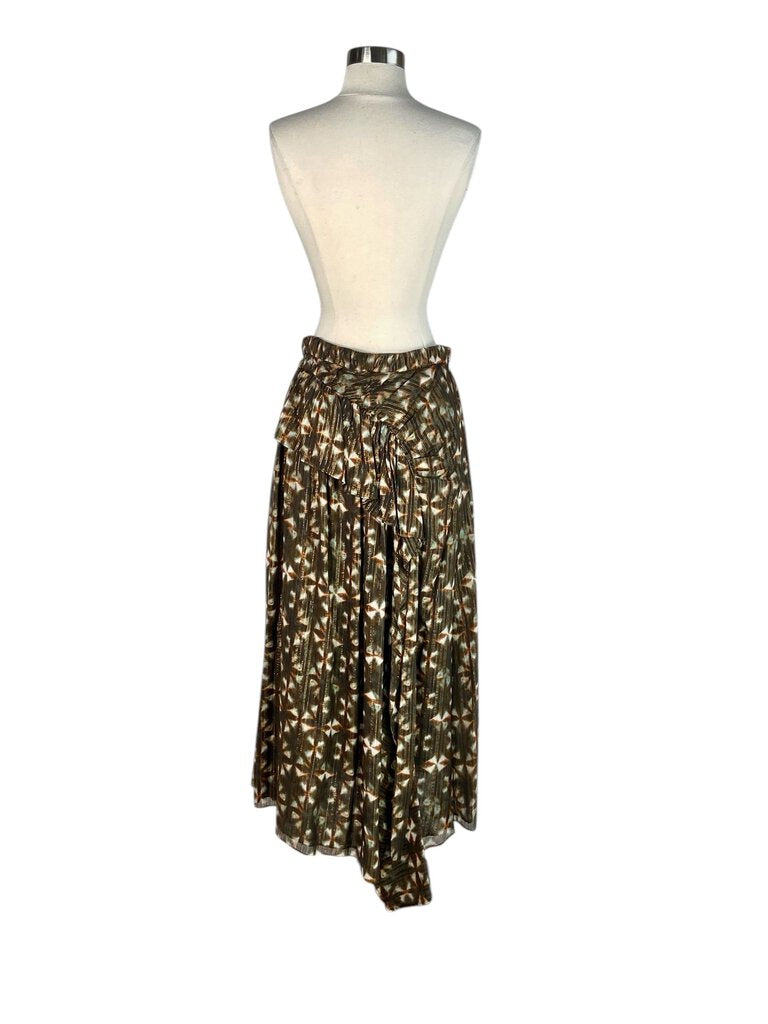 The Ulla Johnson Metallic Tie Dye Gathered Maxi Skirt features a stunning blend of metallic hues and a soft tie-dye pattern, creating a rich, eye-catching effect. Its gathered silhouette offers a relaxed yet flattering fit, making it a versatile piece that adds bohemian elegance and a touch of shimmer to any wardrobe.