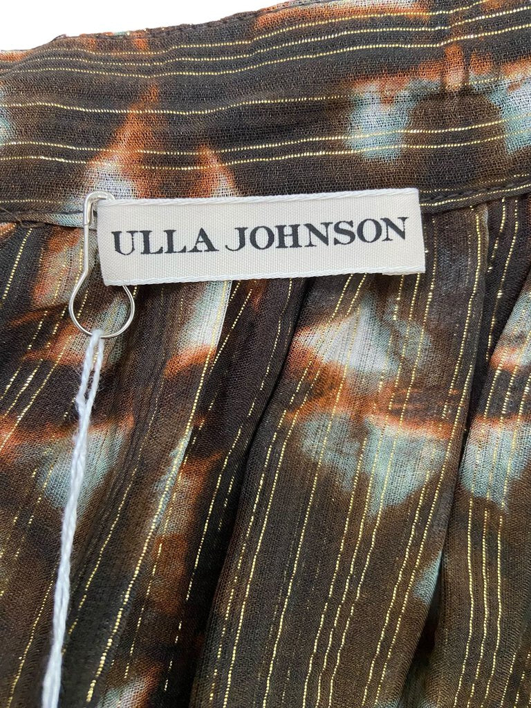 The Ulla Johnson Metallic Tie Dye Gathered Maxi Skirt features a stunning blend of metallic hues and a soft tie-dye pattern, creating a rich, eye-catching effect. Its gathered silhouette offers a relaxed yet flattering fit, making it a versatile piece that adds bohemian elegance and a touch of shimmer to any wardrobe.