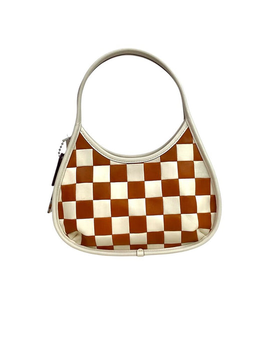 The Coachtopia Ergo Checkerboard Leather Bag is a bold, stylish handbag crafted from smooth leather featuring a striking checkerboard pattern. With its spacious interior and ergonomic design, it offers both fashion and functionality for everyday use.