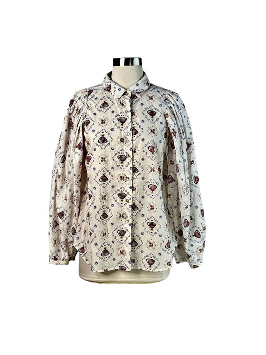 The Caron Callahan Cotton Long Sleeve Print Blouse is a stylish and breezy piece crafted from soft cotton, featuring a unique print for a touch of artistic flair. Its relaxed fit and long sleeves make it perfect for layering or wearing on its own for a laid-back yet polished look.