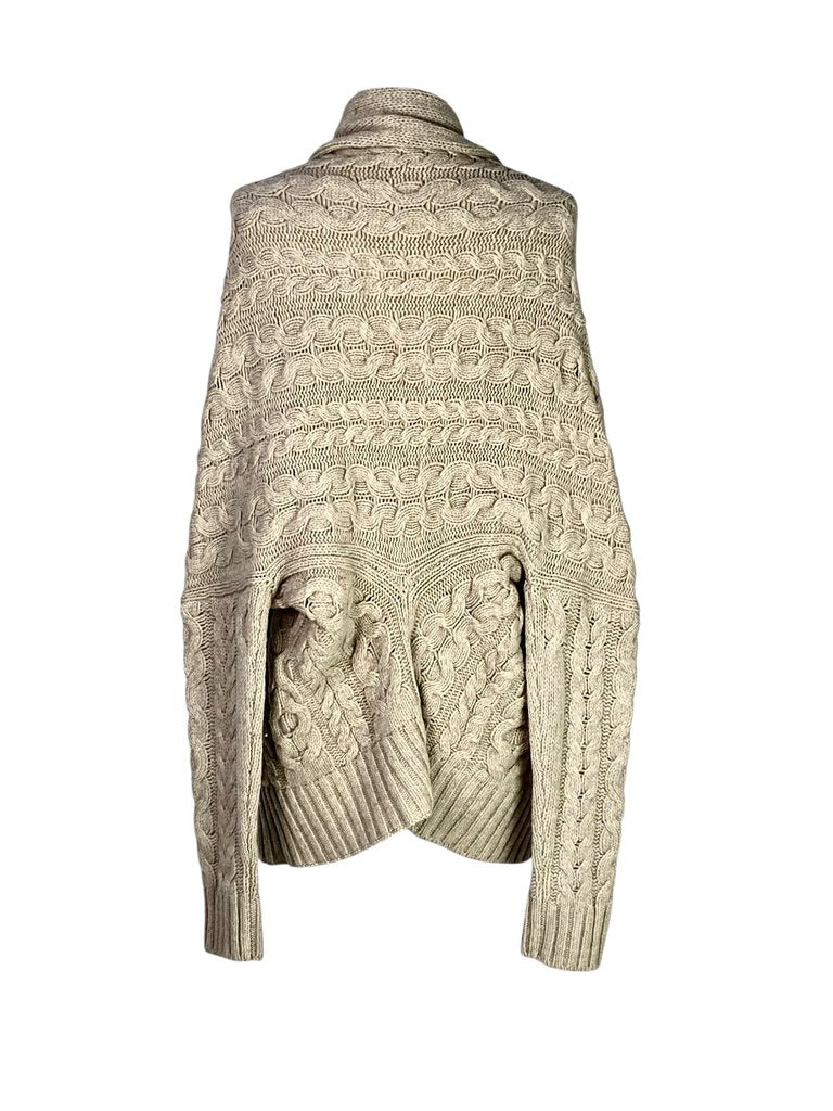 The Vince Cable Knit Shawl Collar Cardigan is a cozy and sophisticated piece, featuring a chunky cable knit design and a relaxed, oversized fit. With its shawl collar and soft, luxe fabric, this cardigan offers warmth and timeless style, perfect for layering over casual or refined looks.