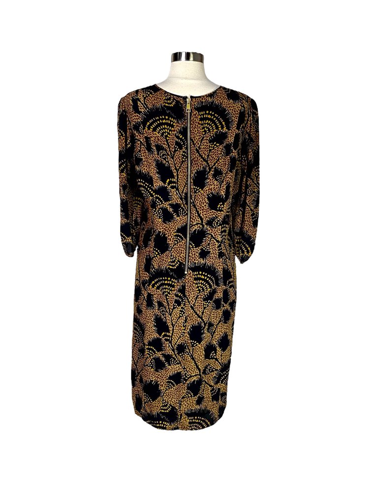 The Burberry Leopard Palm Print Silk Midi Dress combines the brand's signature classic elegance with a bold, exotic print of leopard and palm motifs. Crafted from luxurious silk, its flattering midi length and fluid silhouette create a perfect balance of sophistication and playful allure.