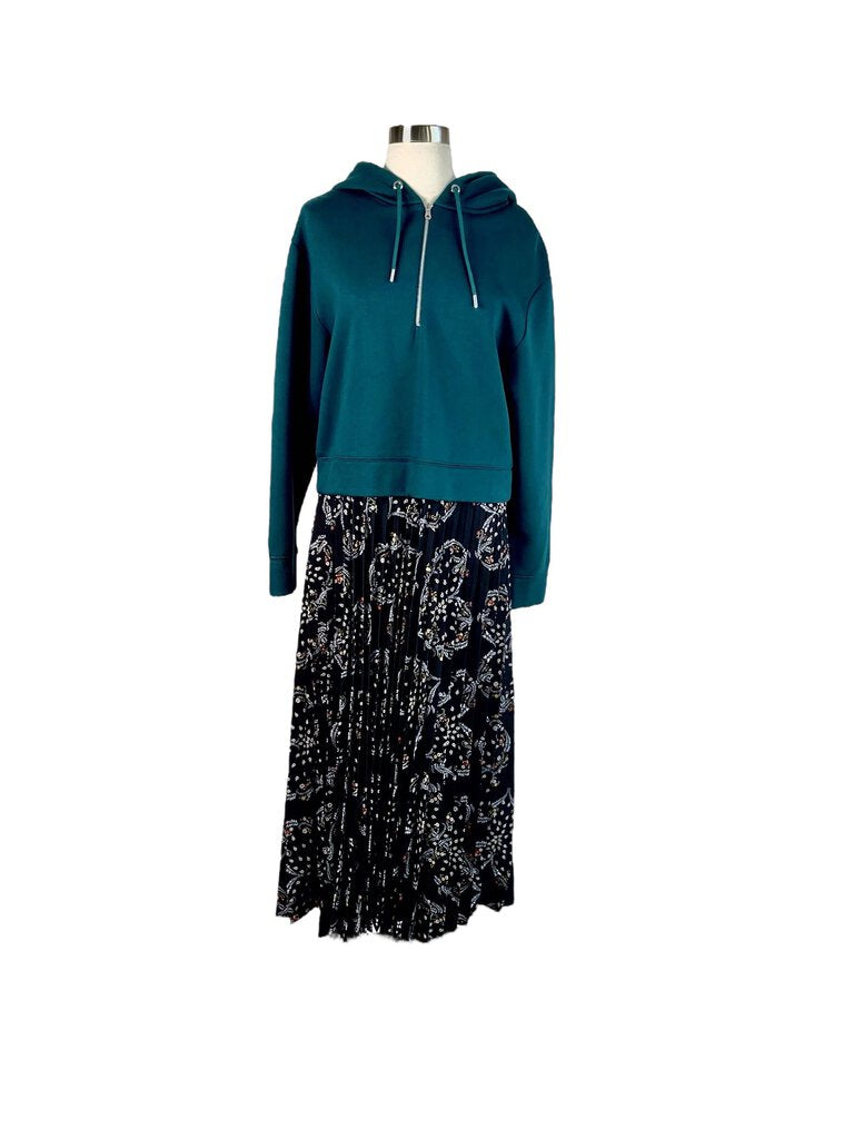 The Sandro Mixed Media Hoodie Pleated Maxi Dress combines casual and sophisticated elements with its relaxed hoodie top and flowing pleated skirt. Crafted from a blend of fabrics, this dress offers a unique fusion of street style and elegant design.