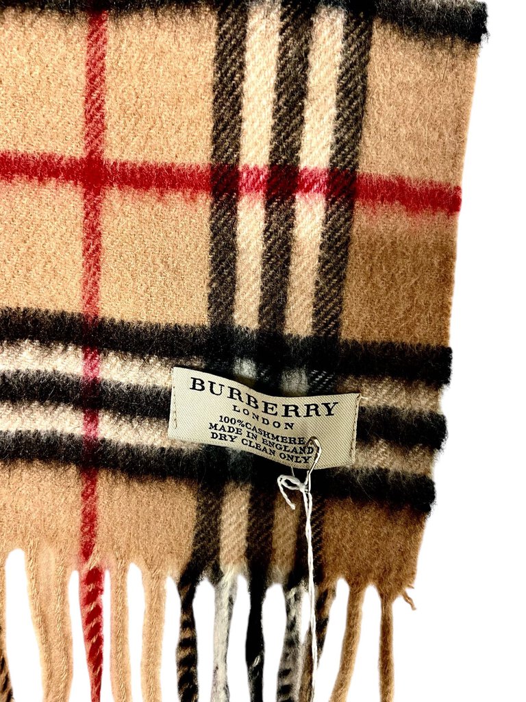 The Burberry Plaid Cashmere Scarf is a timeless accessory, crafted from ultra-soft cashmere and featuring the brand's iconic check pattern. Its luxurious feel and classic design make it a versatile piece that adds warmth and sophistication to any outfit.