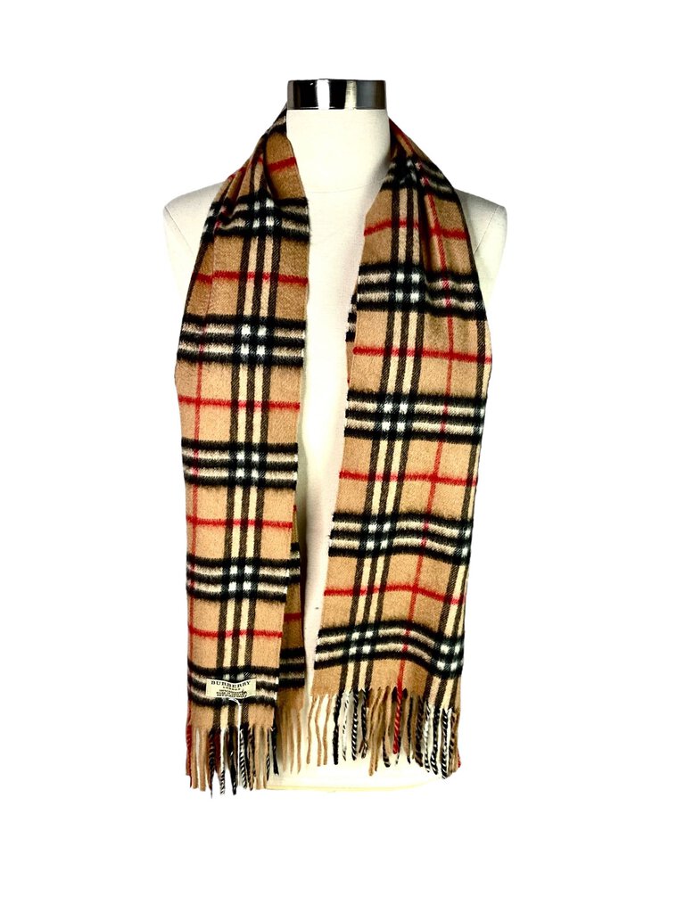 The Burberry Plaid Cashmere Scarf is a timeless accessory, crafted from ultra-soft cashmere and featuring the brand's iconic check pattern. Its luxurious feel and classic design make it a versatile piece that adds warmth and sophistication to any outfit.