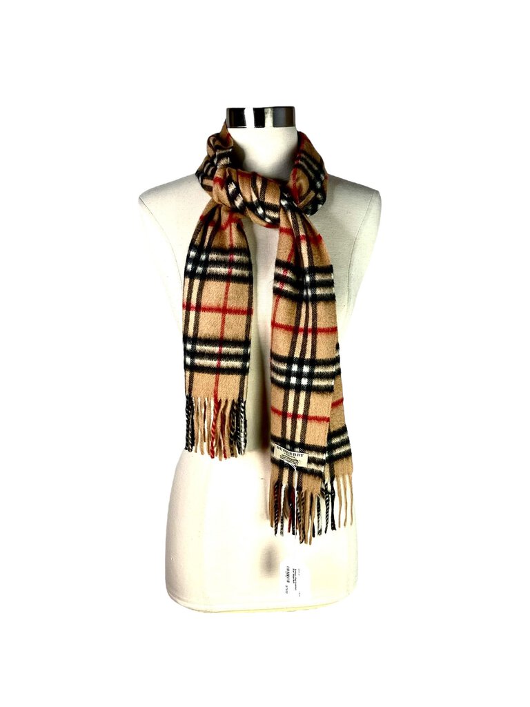 The Burberry Plaid Cashmere Scarf is a timeless accessory, crafted from ultra-soft cashmere and featuring the brand's iconic check pattern. Its luxurious feel and classic design make it a versatile piece that adds warmth and sophistication to any outfit.