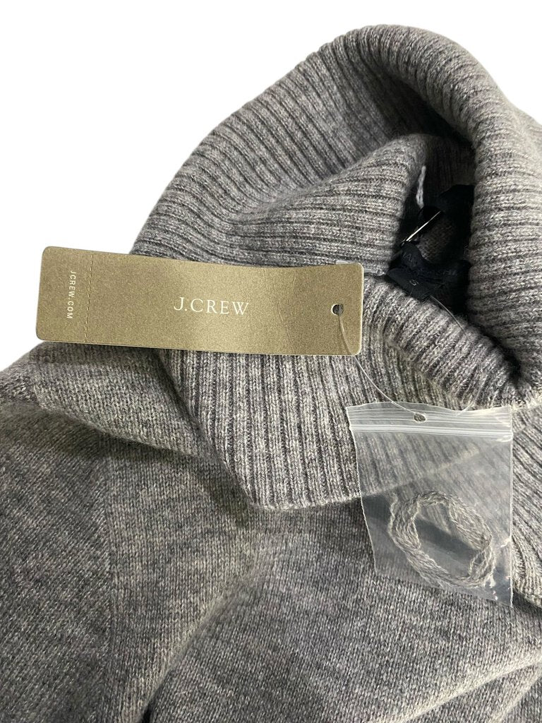 The J.Crew Cashmere Turtleneck Sweater is a wardrobe staple, crafted from soft, luxurious cashmere for ultimate warmth and comfort. Its classic turtleneck design and timeless fit make it the perfect layering piece for both casual and polished outfits.