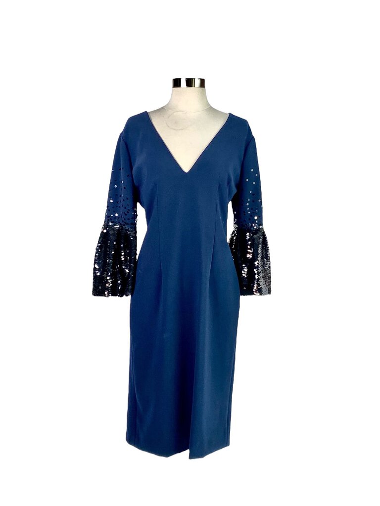 The Sachin & Babi Sequin Sleeve Dress is a glamorous, knee-length cocktail dress that features striking, embellished sequin sleeves for a touch of sparkle and sophistication. Its tailored silhouette and elegant design make it perfect for formal events or upscale soirées.