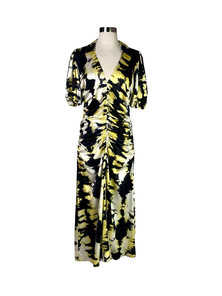 The Ganni Silk Ruched Abstract Print Midi Dress features a luxurious silk fabric adorned with an eye-catching abstract print. With its flattering ruching and midi-length silhouette, this dress effortlessly combines elegance and contemporary style for a bold yet feminine look.