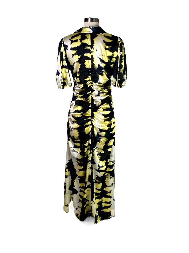 The Ganni Silk Ruched Abstract Print Midi Dress features a luxurious silk fabric adorned with an eye-catching abstract print. With its flattering ruching and midi-length silhouette, this dress effortlessly combines elegance and contemporary style for a bold yet feminine look.