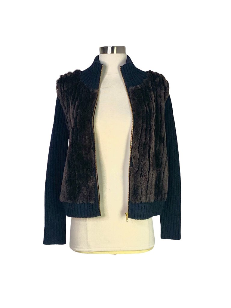 The Neiman Marcus Cashmere/Fur Zip Front Jacket Sweater offers a luxurious fusion of soft cashmere and plush fur accents, creating an elegant and cozy piece. With its zip-front design and relaxed fit, it provides both warmth and sophistication, making it perfect for layering over casual or refined outfits.