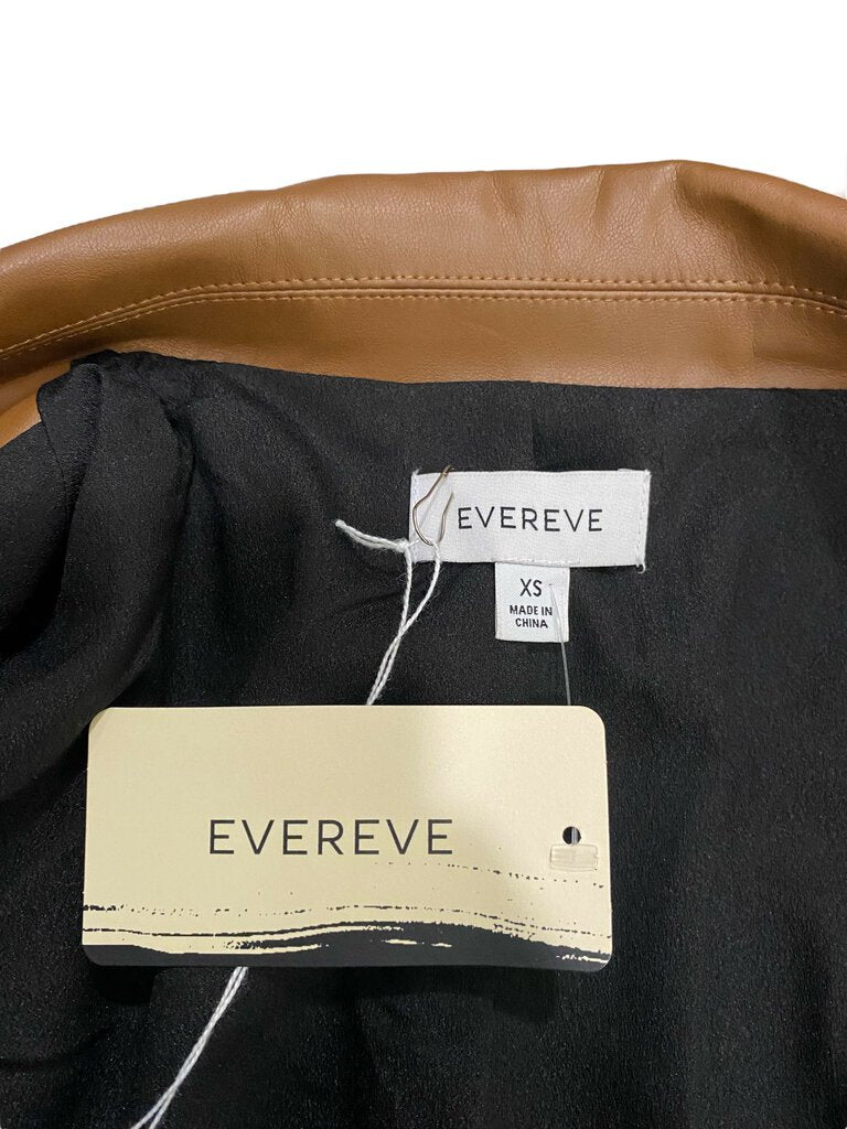 The Evereve Vegan Leather Blazer combines the sharp tailoring of a classic blazer with the edgy appeal of vegan leather, creating a sleek and contemporary look. Its structured fit, clean lines, and versatile design make it a chic alternative to traditional outerwear, perfect for elevating both casual and dressy outfits.