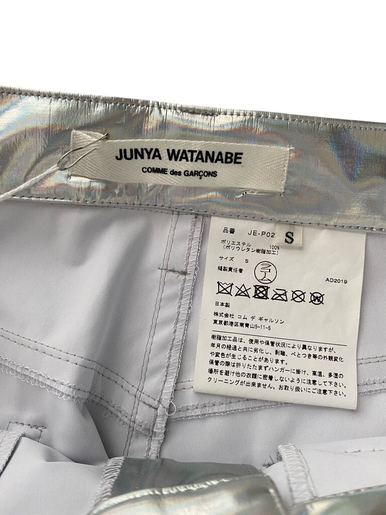 The Junya Watanabe Holographic Jeans make a bold fashion statement with their reflective, futuristic fabric and sleek, tailored fit. Blending avant-garde design with street-style edge, they offer a unique and daring twist on classic denim.