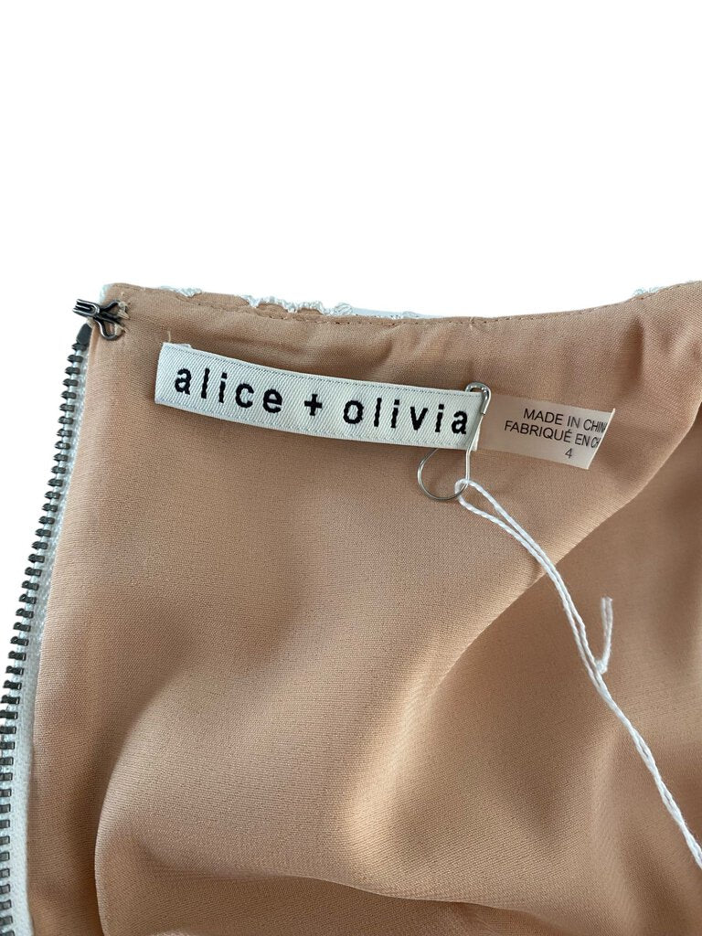 The Alice + Olivia Clyde Shift Dress combines classic simplicity with modern flair, featuring a flattering, A-line silhouette and sleek, minimalist design. Made from a comfortable fabric, it’s a versatile piece that effortlessly transitions from day to night with a chic, sophisticated edge.