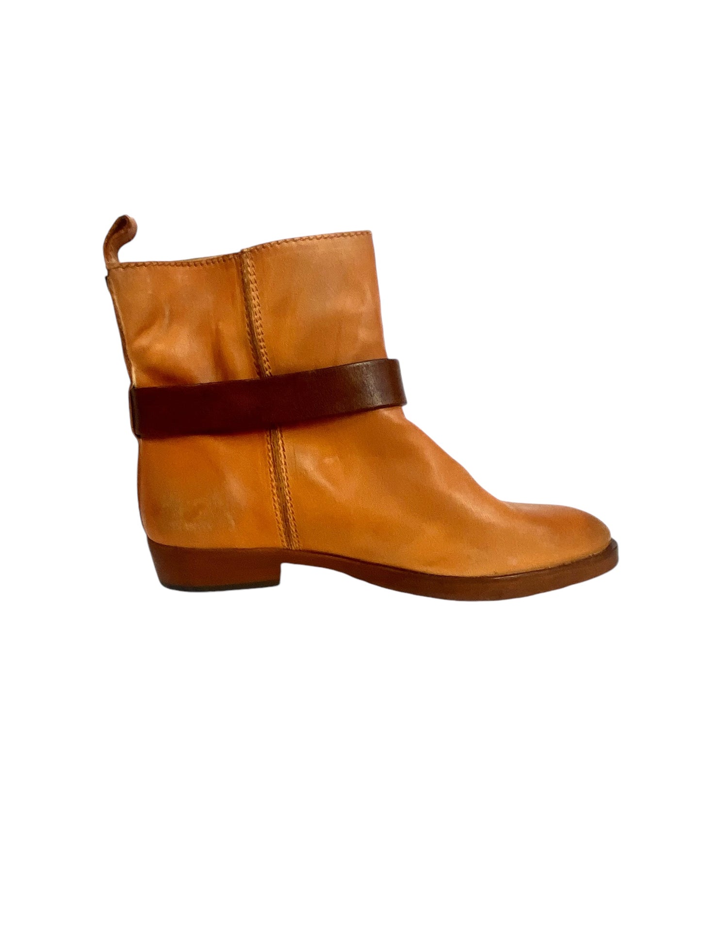 The Hollywood Trading Company Gwen Ankle Bootie is a stylish and edgy choice, featuring a sleek design with unique detailing that adds character. Crafted from high-quality materials, these booties offer both comfort and versatility, making them perfect for elevating casual outfits or adding flair to more polished looks.