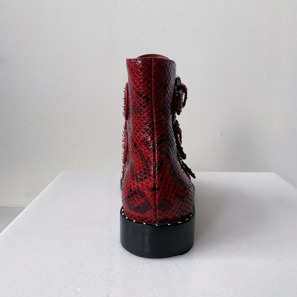 Givenchy “Elegant Flank Combat Boots “.   Ankle Hihh Snake-Embossed Studded Calfskin Boots, With Box.  Pointed-Toe.  Multi strap & Buckle Closure At Uppers.  1 inch heel
